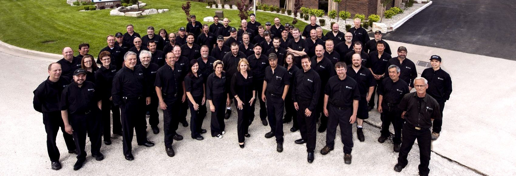 The employees that make us leaders in mold making group outside in front of Cavalier's world headquarters.